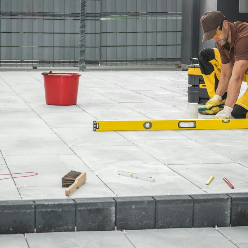Outdoor Patio Tiles Installation by Professional Worker